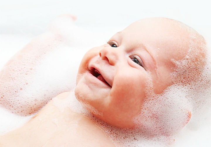 A baby in a bubble bath